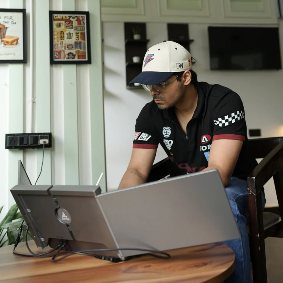 Person using RIITEK 14 inch tri-screen laptop screen extender for home office productivity setup
