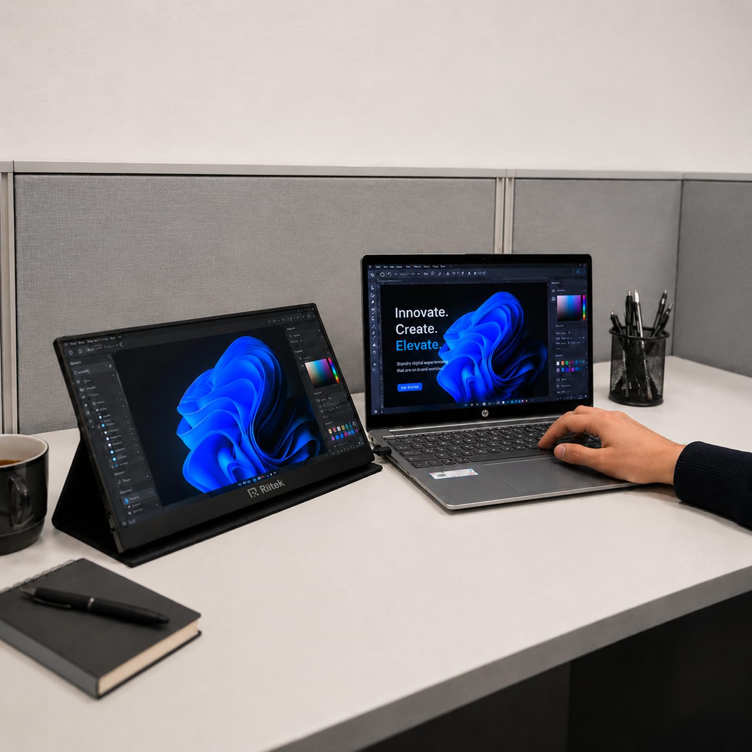 RIITEK 15.6 inch portable monitor used as second screen for creative design work alongside laptop
