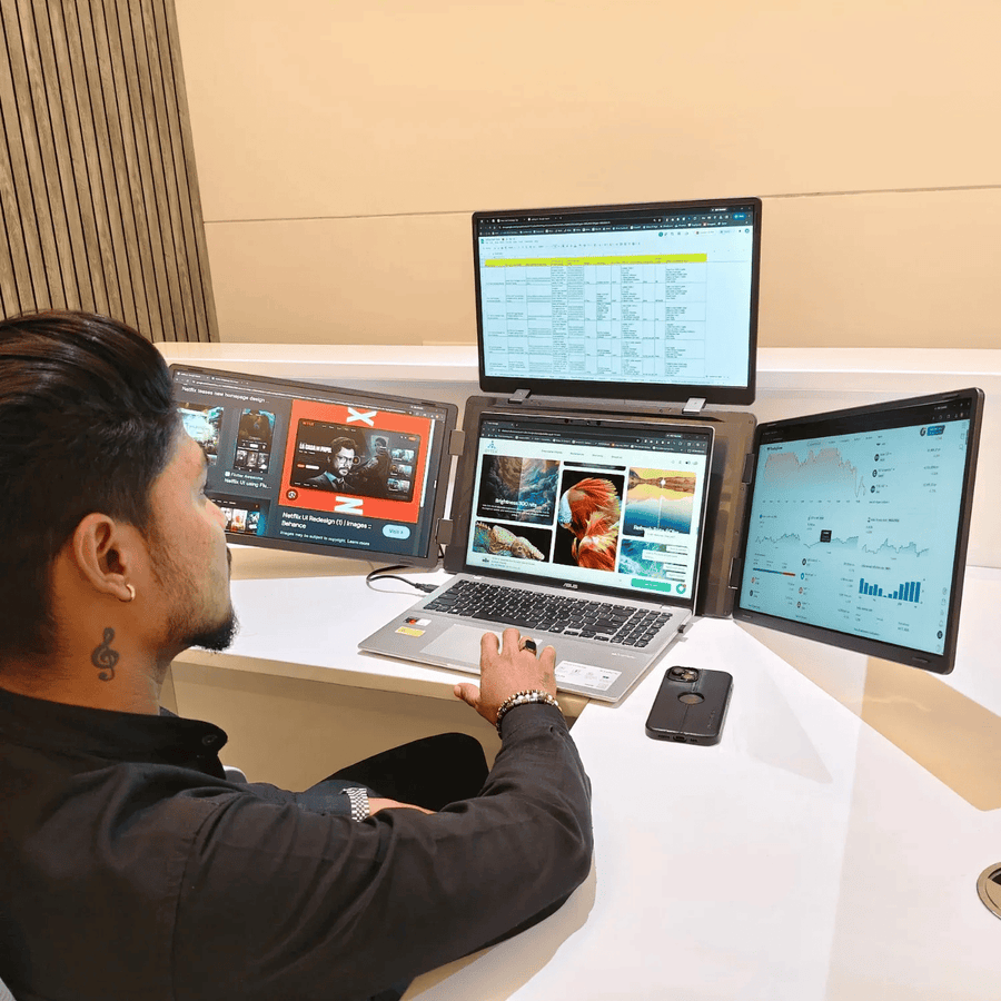 RIITEK 16 inch quad monitor in use for multitasking with spreadsheets design and trading charts